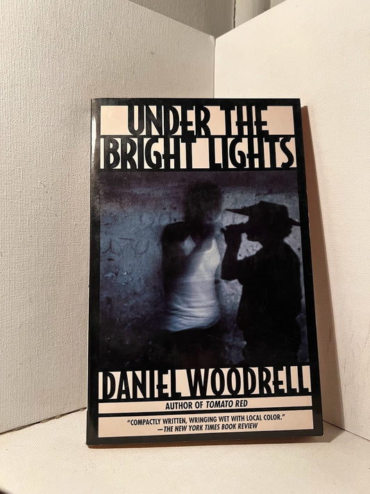 Under the Bright Lights by Daniel Woodrell